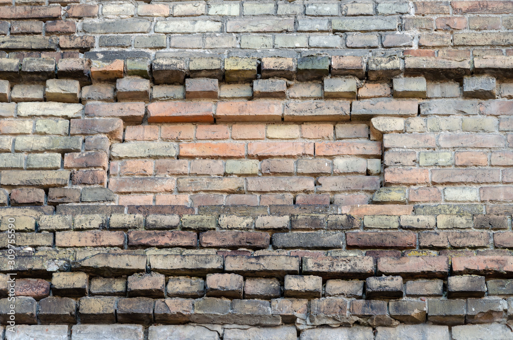 Fototapeta premium brick wall. old ruined building. Building ready to be demolished. Texture. Empty background.