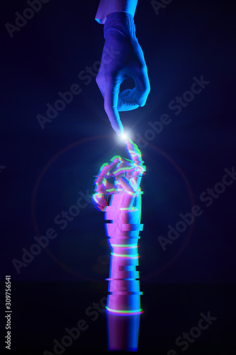 Touching fingers of engineer and digital technology that he creates. Acquaintance of man and technology.