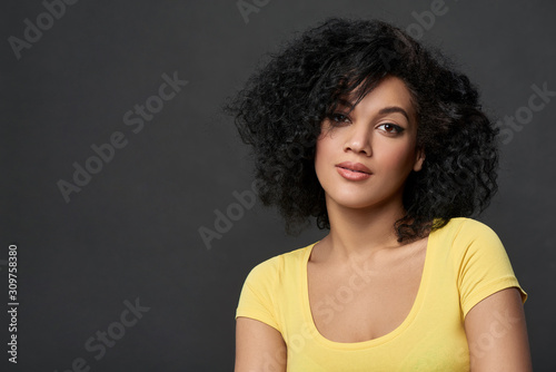 Quadro em tela Happy woman looking at camera smiling