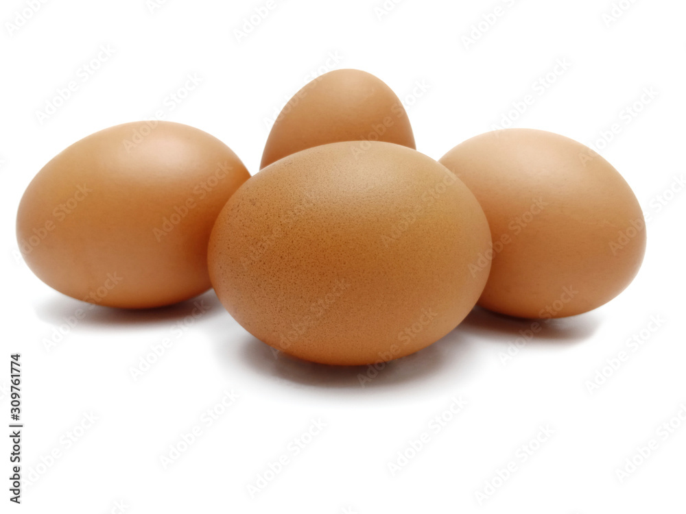 Raw fresh brown chicken eggs isolated on white background. Raw fresh brown chicken eggs isolated on white background.