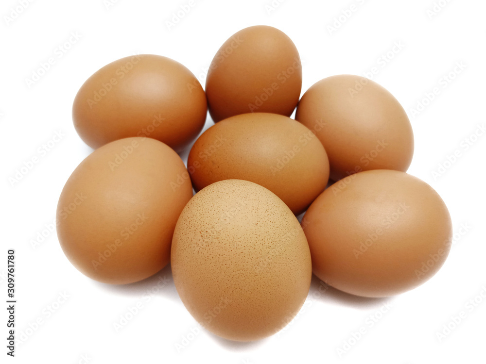 Raw fresh brown chicken eggs isolated on white background.
