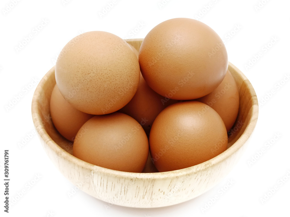 Raw fresh brown chicken eggs isolated on white background. Raw fresh brown chicken eggs isolated on white background.
