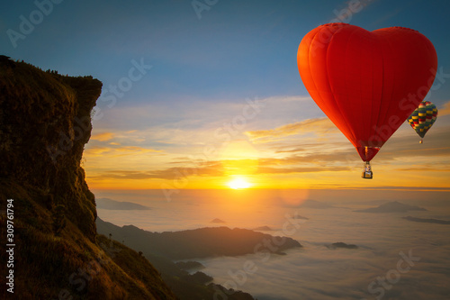 Fotografiet Heart shape hot air balloon fly over Phucheefah mountain