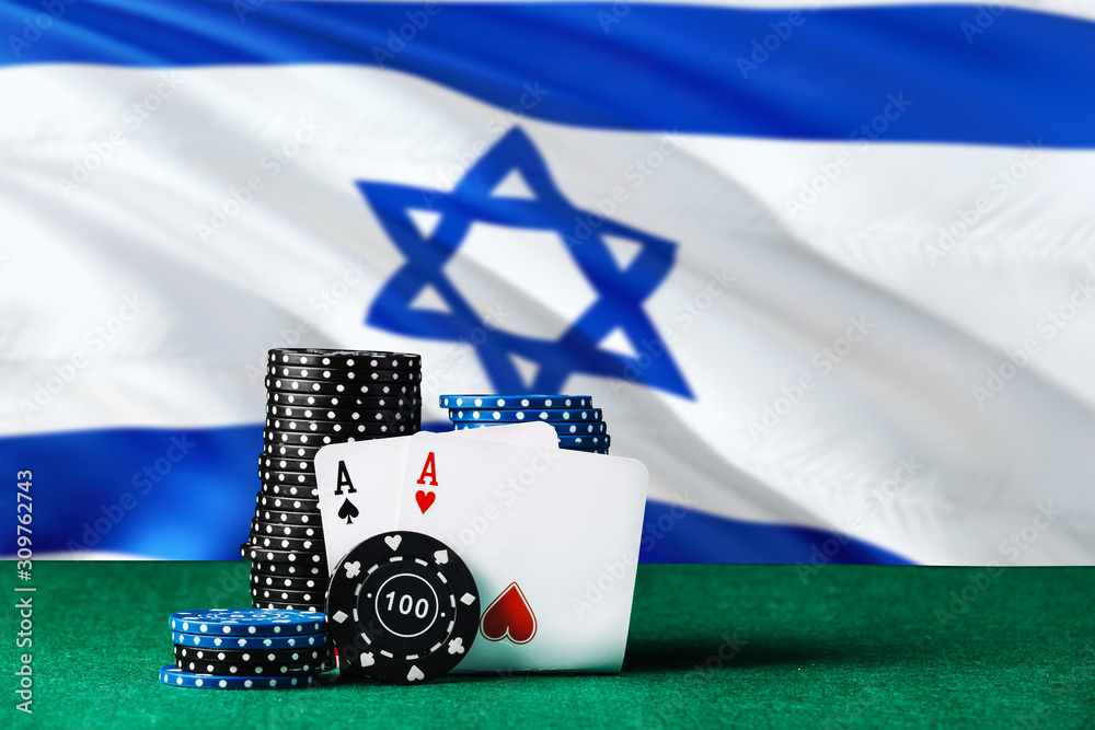 Israel casino theme. Two ace in poker game, cards and black chips on green table with national flag background. Gambling and betting.