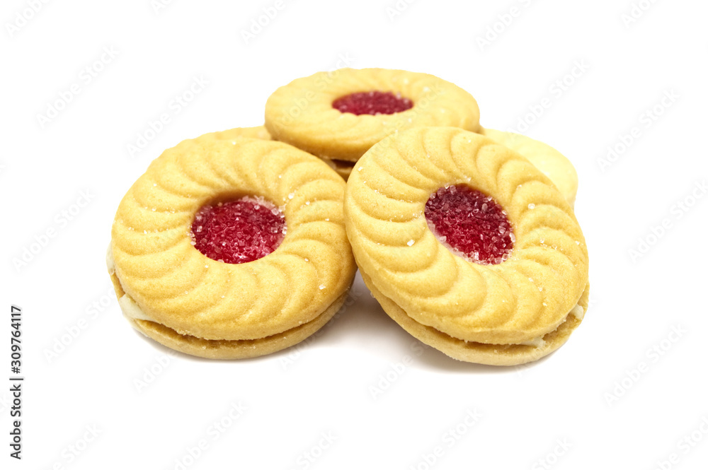 Biscuit sandwich butter cookies with cream and strawberry flavoured jam. A stack of crunchy delicious sweet meal and useful cracker. isolated on white background. Soft focus. Biscuit sandwich butter cookies with cream and strawberry flavoured jam. A stack of crunchy delicious sweet meal and useful cracker. isolated on white background. Soft focus.