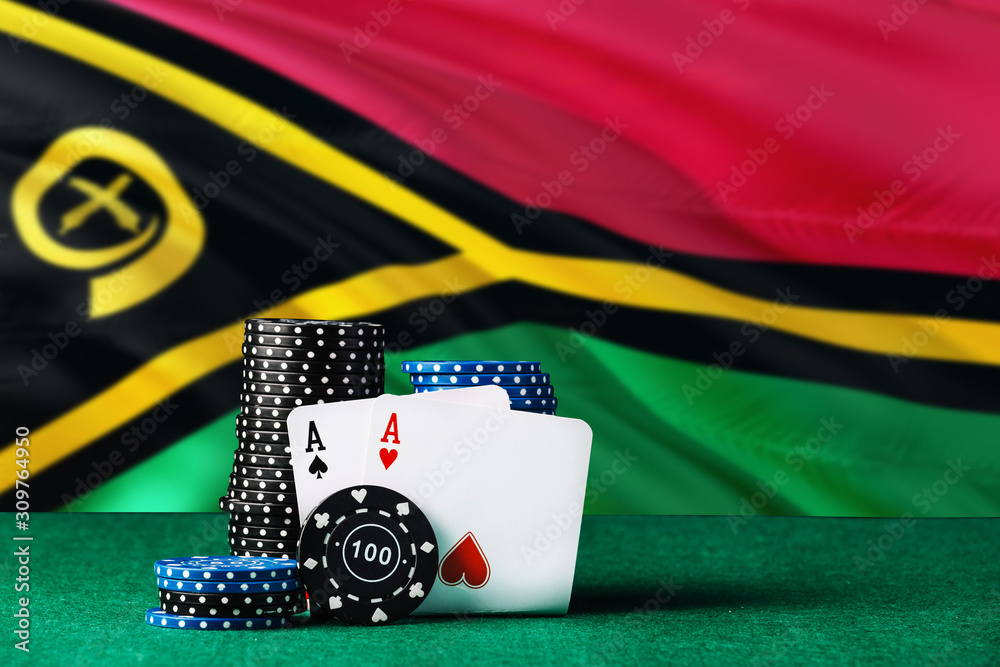 Vanuatu casino theme. Two ace in poker game, cards and black chips on green table with national flag background. Gambling and betting.