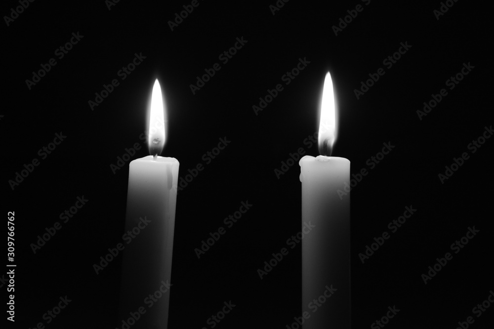 Two candles burning in the dark Two candles burning in the dark