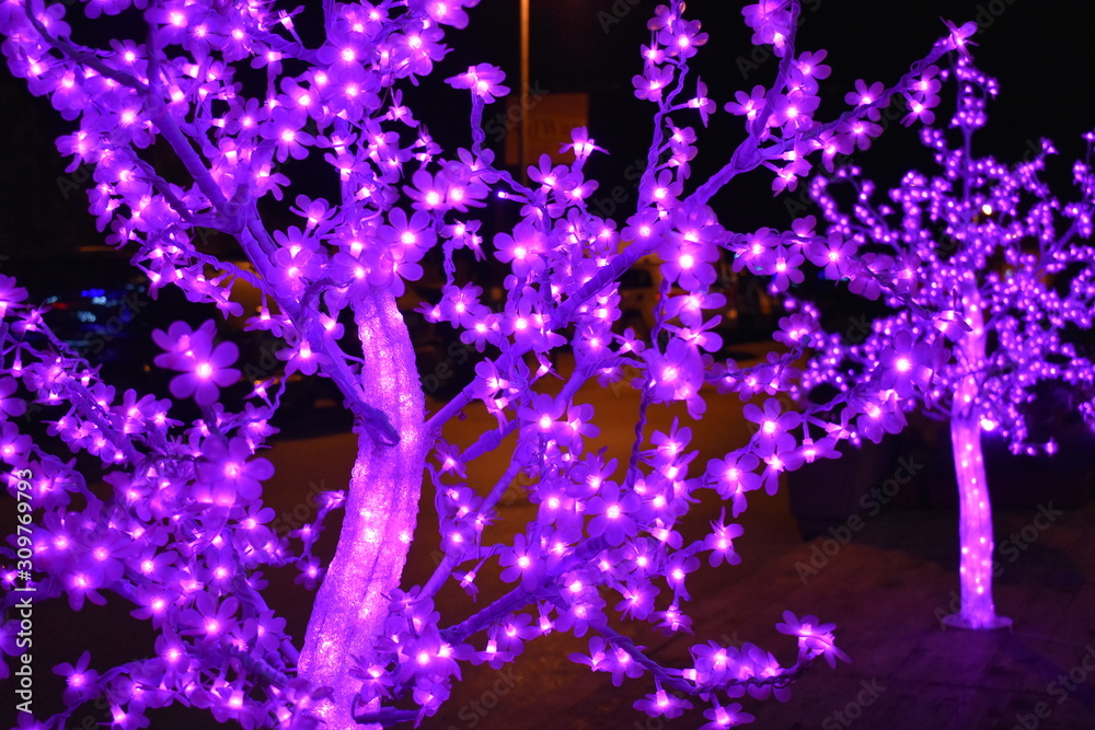 Illuminated tree in violet abstract