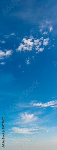 Fantastic clouds against blue sky, panorama