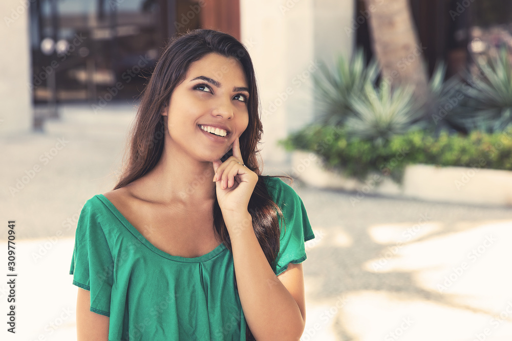 Thinking latin american young adult woman with long dark hair Thinking latin american young adult woman with long dark hair