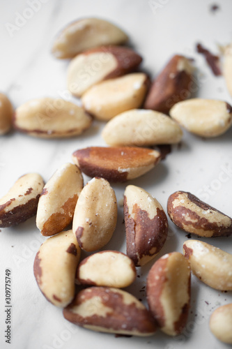 Brazil nuts on white marble background