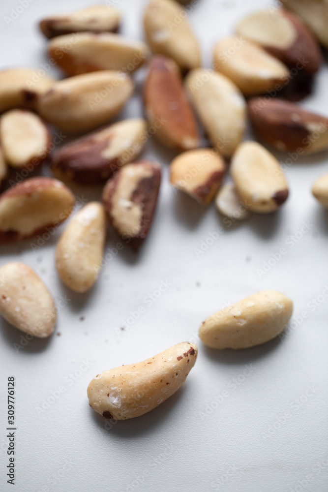 Brazil nuts on white marble background Brazil nuts on white marble background