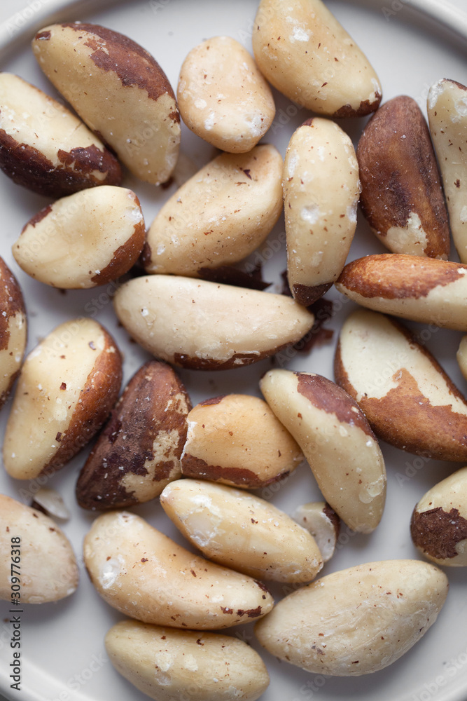 Brazil nuts on white marble background Brazil nuts on white marble background