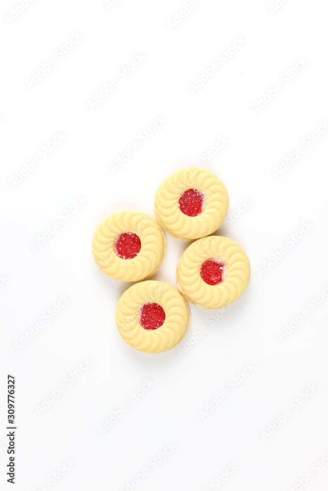 Sandwich cookies with cream and strawberry flavoured jam on white background Sandwich cookies with cream and strawberry flavoured jam on white background