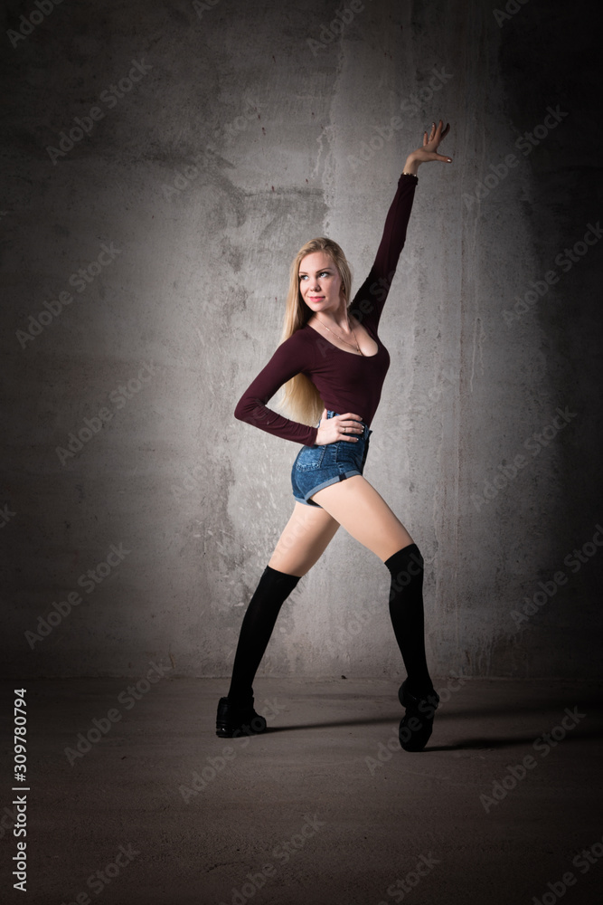 Girl dancer in an elegant, unusual pose. Beautiful girl with long hair.sport, ballet, modern, beautiful, amazing, passion, sexy, unusual, healthy lifestyle, life in Art, a great body, choreography 