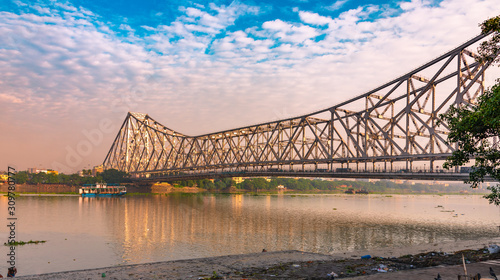 Howrah Bridge is a bridge with a suspended span over the Hooghly River in West Bengal, India. photo