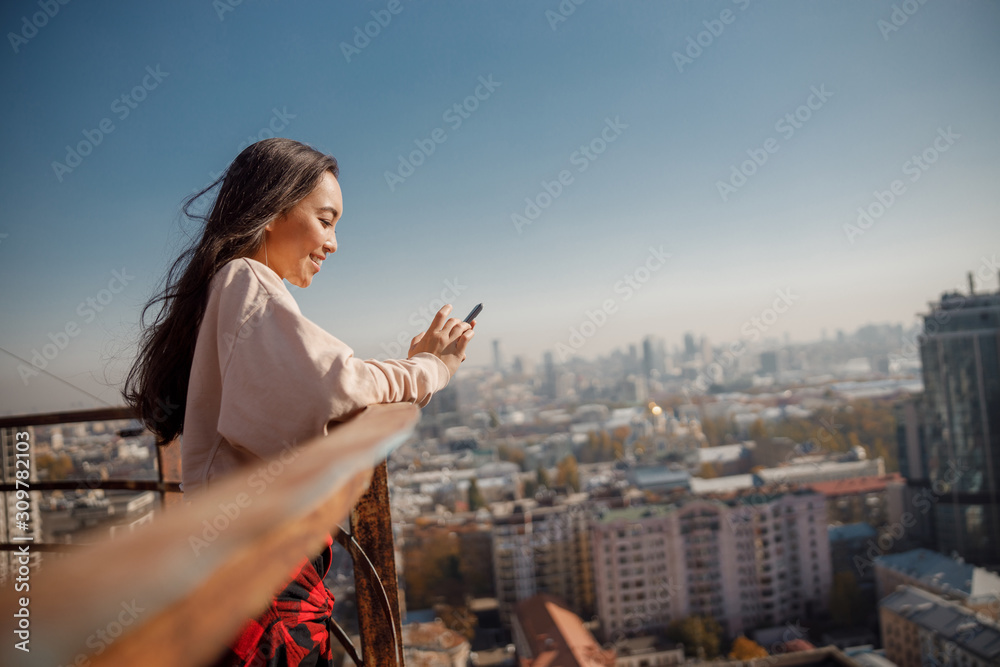 Pretty Asian lady is resting on rooftop Pretty Asian lady is resting on rooftop