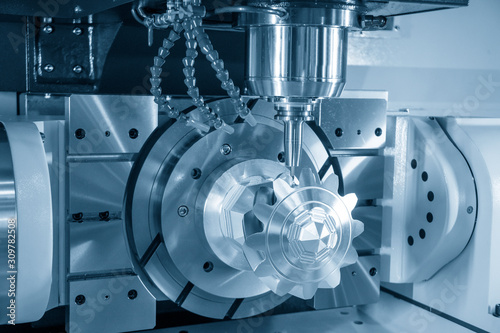 фотографія The 5-axis CNC milling machine  cutting the sample of aluminium  parts by solid ball endmill tools