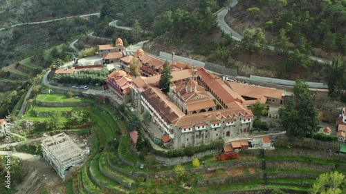 Aerial view of ancient Machairas Monastery in Cyprus Mountains. Beautiful view of old religious mediterranean architecture in green nature landscape photo