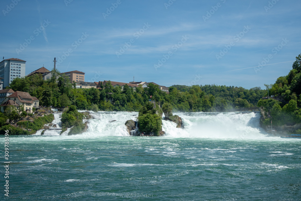 Beautiful scene of rock observation at Rhein fall with green trees and blue sky , background, copy space , Switzerland Beautiful scene of rock observation at Rhein fall with green trees and blue sky , background, copy space , Switzerland