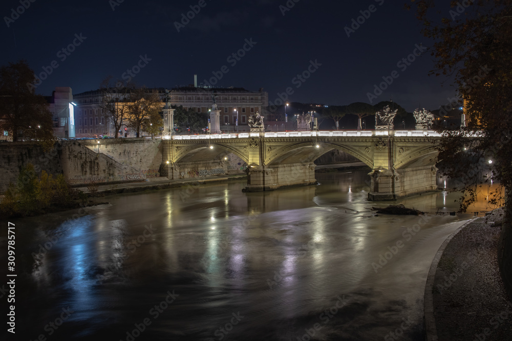 Rome, Italy 20 december 2019.Bridge of Angels near to Sant' Angelo Castel and Vatican City with view of Tiber River. View in the nigth.