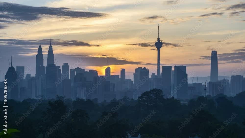 4k time lapse of clear sunrise from Kuala Lumpur city skyline. Tilt up 4k time lapse of clear sunrise from Kuala Lumpur city skyline. Tilt up