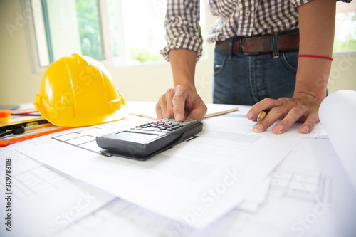 Hand engineers are writing home construction designs to bring them to prospective customers.