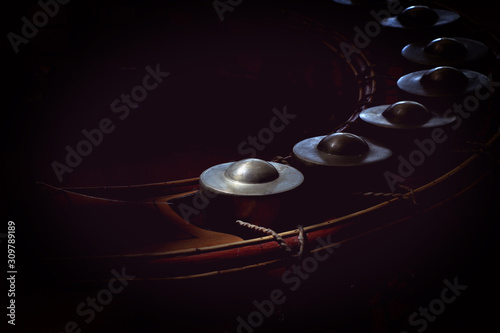 small gongs or gongs wong in dark background, asia tradition percussion instrument, original Thai music instrument. photo
