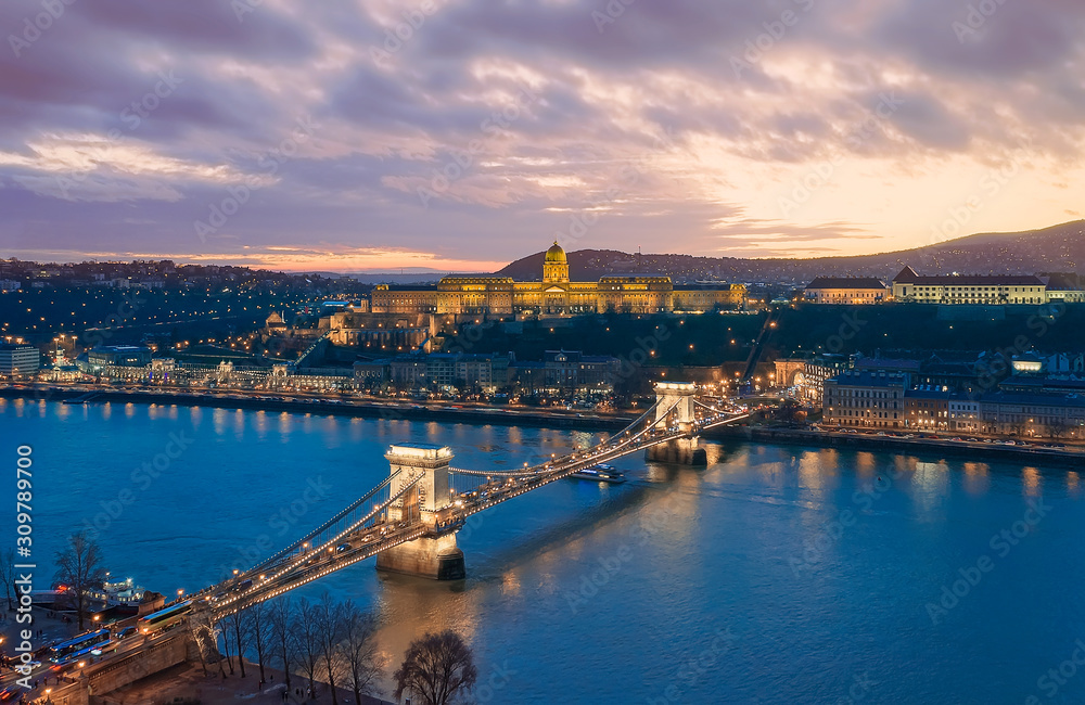 Sunset cityscape from Budapest with Danube river, Szechenyi chain bridge, Buda caslle, Varkert bazaar  and sandor palace.