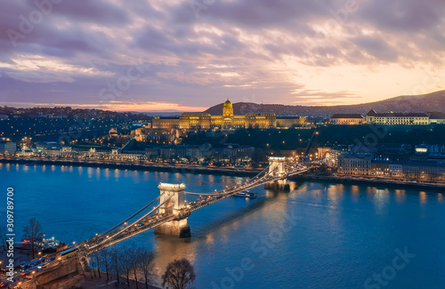 Sunset cityscape from Budapest with Danube river, Szechenyi chain bridge, Buda caslle, Varkert bazaar and sandor palace.