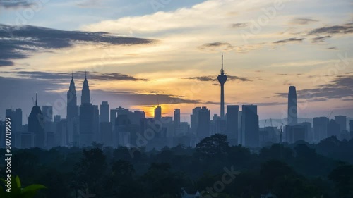 4k time lapse of clear sunrise from Kuala Lumpur city skyline. 