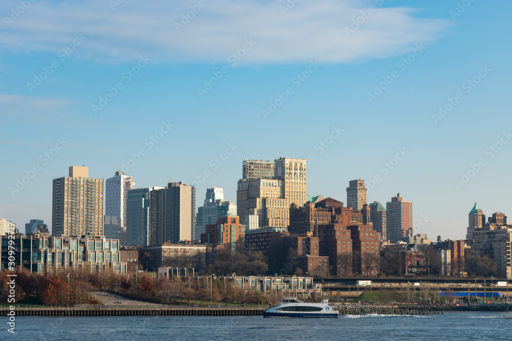 Brooklyn Heights Skyline with the East River in New York City with a Ferry Boat