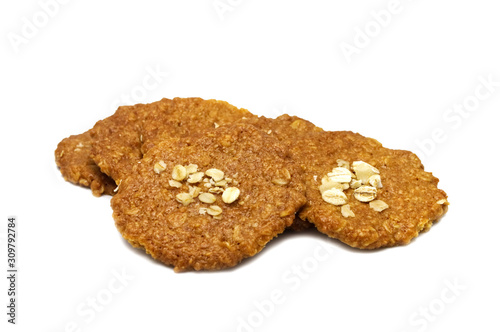 Biscuits homemade Oatmeal flavoured and Thin style. Stack of crunchy delicious sweet meal and useful cookies. Isolated on white background.
