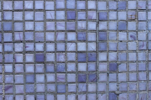 Small tiles of different colors on the wall. Moscow. Russia.
