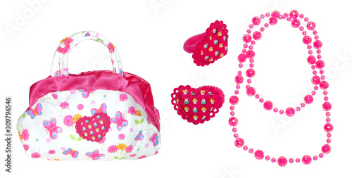 Baby bag, hair bands and beads on a white isolated background. Children's set for girls with butterflies and flowers.