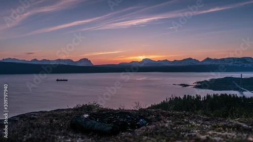 Vibrant golden hour sunset feather sky sunset with light windy breeze in Northern Norway Narvik, Lofoten. photo