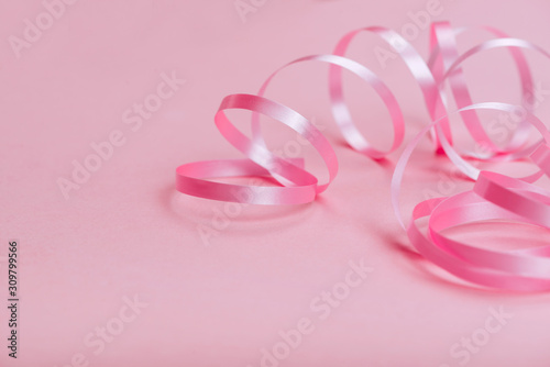 beautiful pink ribbon on bright background copy space