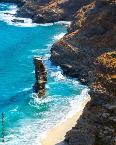 Photo of iconic beach of Grias Pidima near village of Korthi, with rare geological rock and turquoise clear waters, Andros island, Cyclades, Greece photo