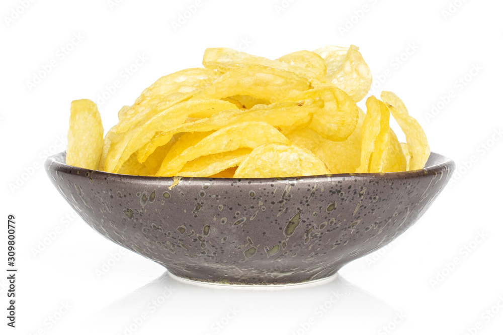 Lot of whole fried crisp potato chip in glazed bowl isolated on white background Lot of whole fried crisp potato chip in glazed bowl isolated on white background