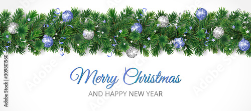 Christmas banner with Merry Christmas text and pine tree garland isolated on white. Blue and silver ornaments.