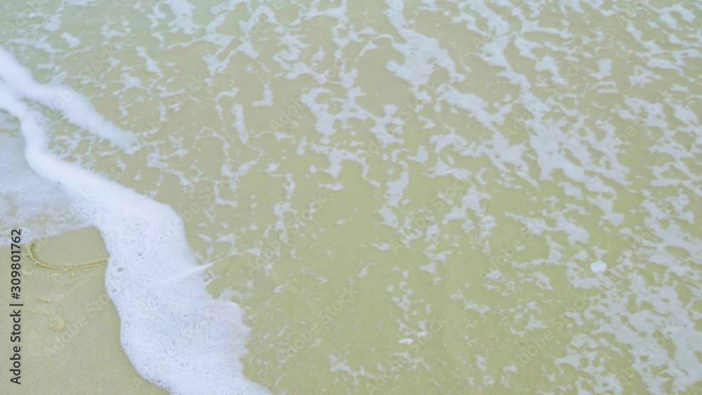 4K vdo 2020 new year activity from text 2019 was cleaned by wave of sea and change to 2020 with sand background and copyspace 4K vdo 2020 new year activity from text 2019 was cleaned by wave of sea and change to 2020 with sand background and copyspace