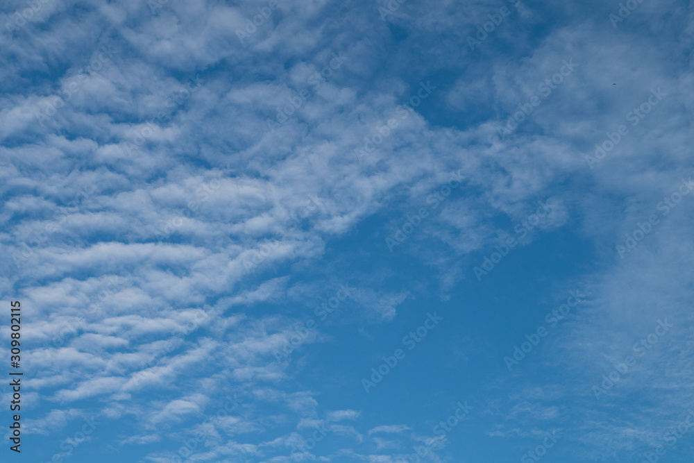 Natural clear blue sky with some clouds cloudscape for background or backdrop freedom concept