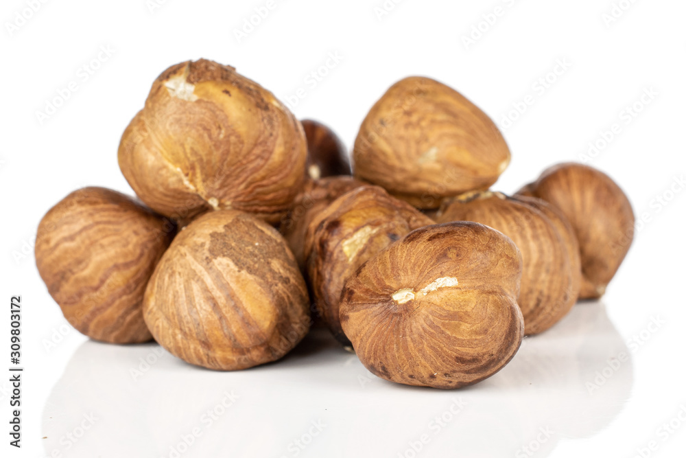 Lot of whole tasty brown hazelnut isolated on white background Lot of whole tasty brown hazelnut isolated on white background