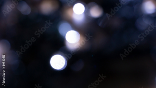 Abstract light, bokeh effect, new year lights. Dark background, bokeh light. © MiaStendal