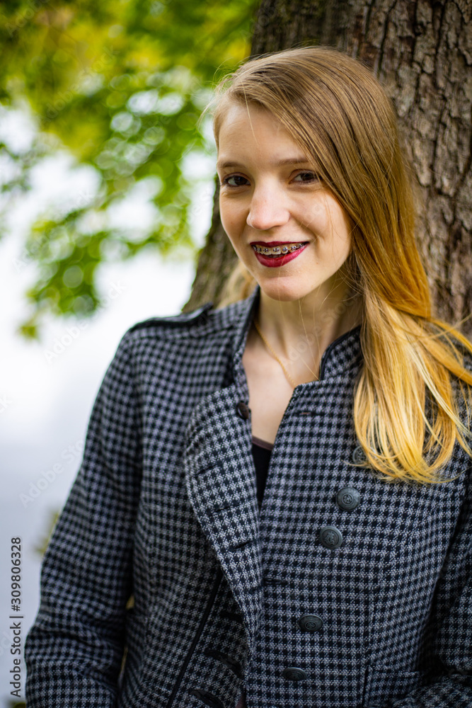 portrait of young woman in autumn park