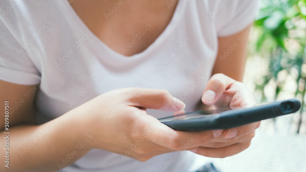 Asian woman hand using smartphone to contact with email, message, chatting online or shopping, customer service or technology concept Asian woman hand using smartphone to contact with email, message, chatting online or shopping, customer service or technology concept