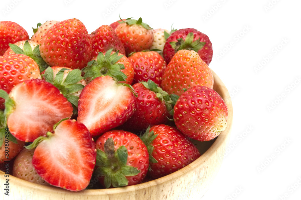 Strawberries in wooden bowl isolated on white background.
