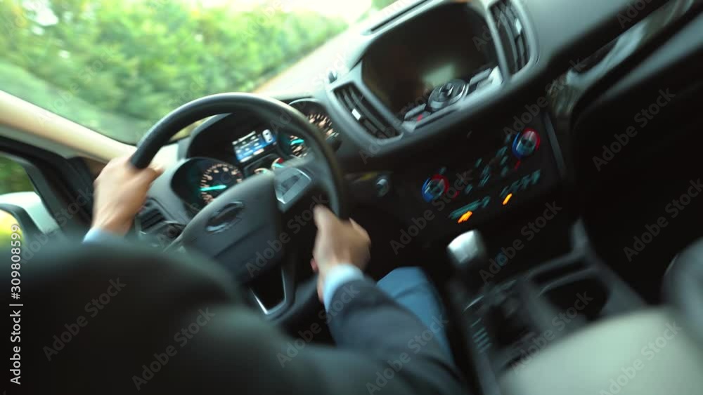 Dangerous driving. Man driving a car on the road in sunny weather and loses control during the ride Dangerous driving. Man driving a car on the road in sunny weather and loses control during the ride
