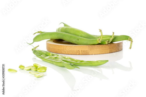 Wallpaper Mural Group of lot of whole two halves lot of pieces of snap green bean on round bamboo coaster isolated on white background Torontodigital.ca