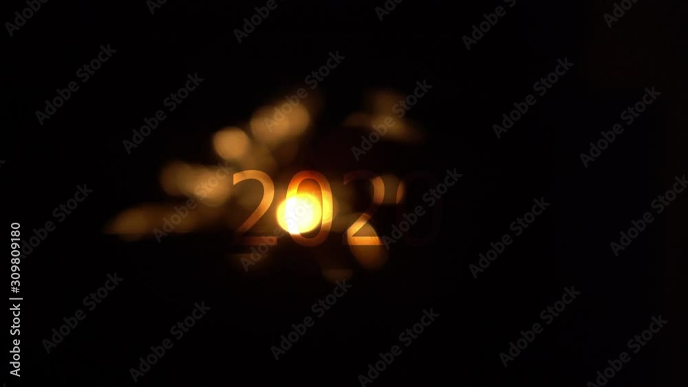 Sparks fireworks at black background with 2020 New Year text Sparks fireworks at black background with 2020 New Year text
